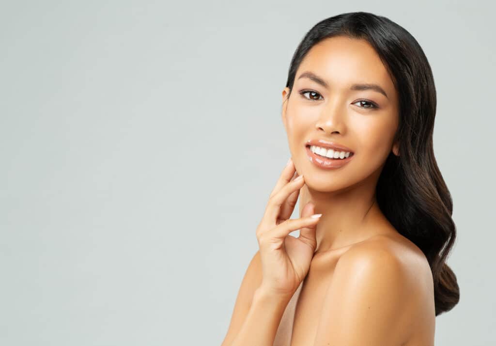 Woman smiling and showing the results of aesthetic laser treatments in Palm Beach Gardens Thomas Pane, MD Plastic Surgery