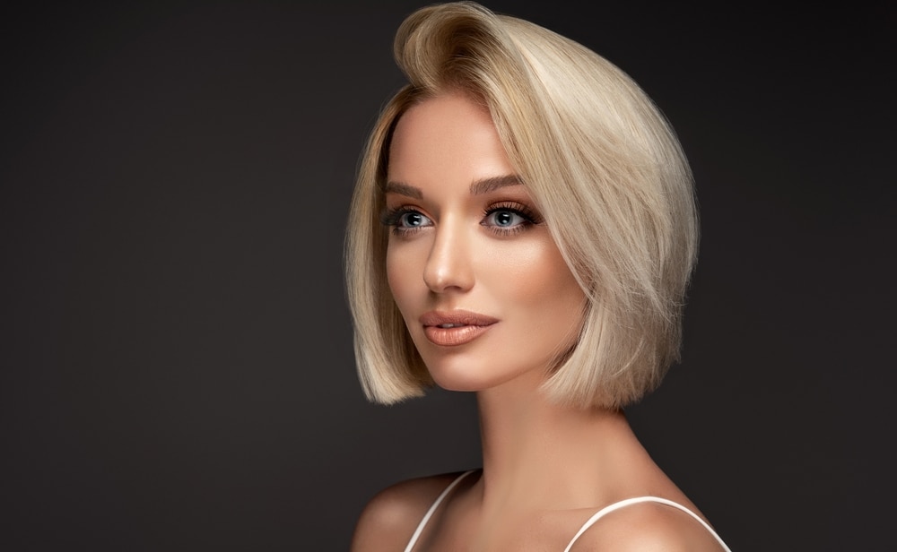 Blonde woman with smooth facial contours representing Radiesse facial rejuvenation in Palm Beach Gardens.