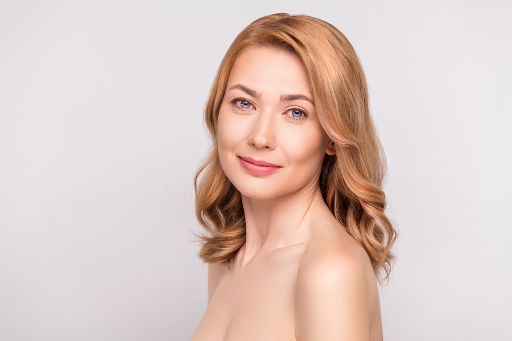 Woman with smooth facial contours representing natural-looking Sculptra results in Palm Beach Gardens.