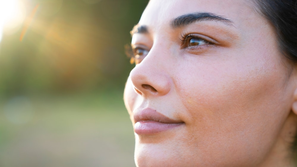 Close-up of woman’s face representing skin cancer evaluation and early detection in Palm Beach Gardens.