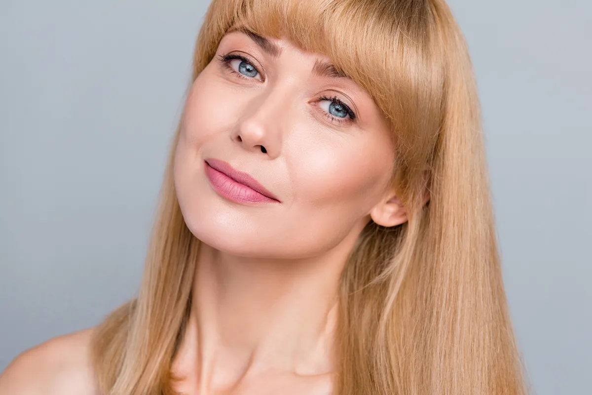 Mature woman with a smooth, defined lower face and jawline.