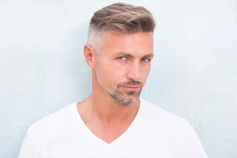 Mature man with short hair and a defined jawline.